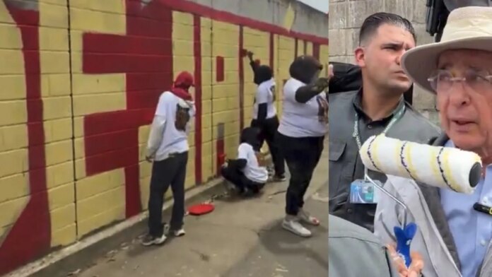 polemica-frente-a-la-casa-de-alvaro-uribe-en-antioquia-por-grupo-de-personas-que-se-reunio-a-pintar-un-mural-sobre-‘falsos-positivos’